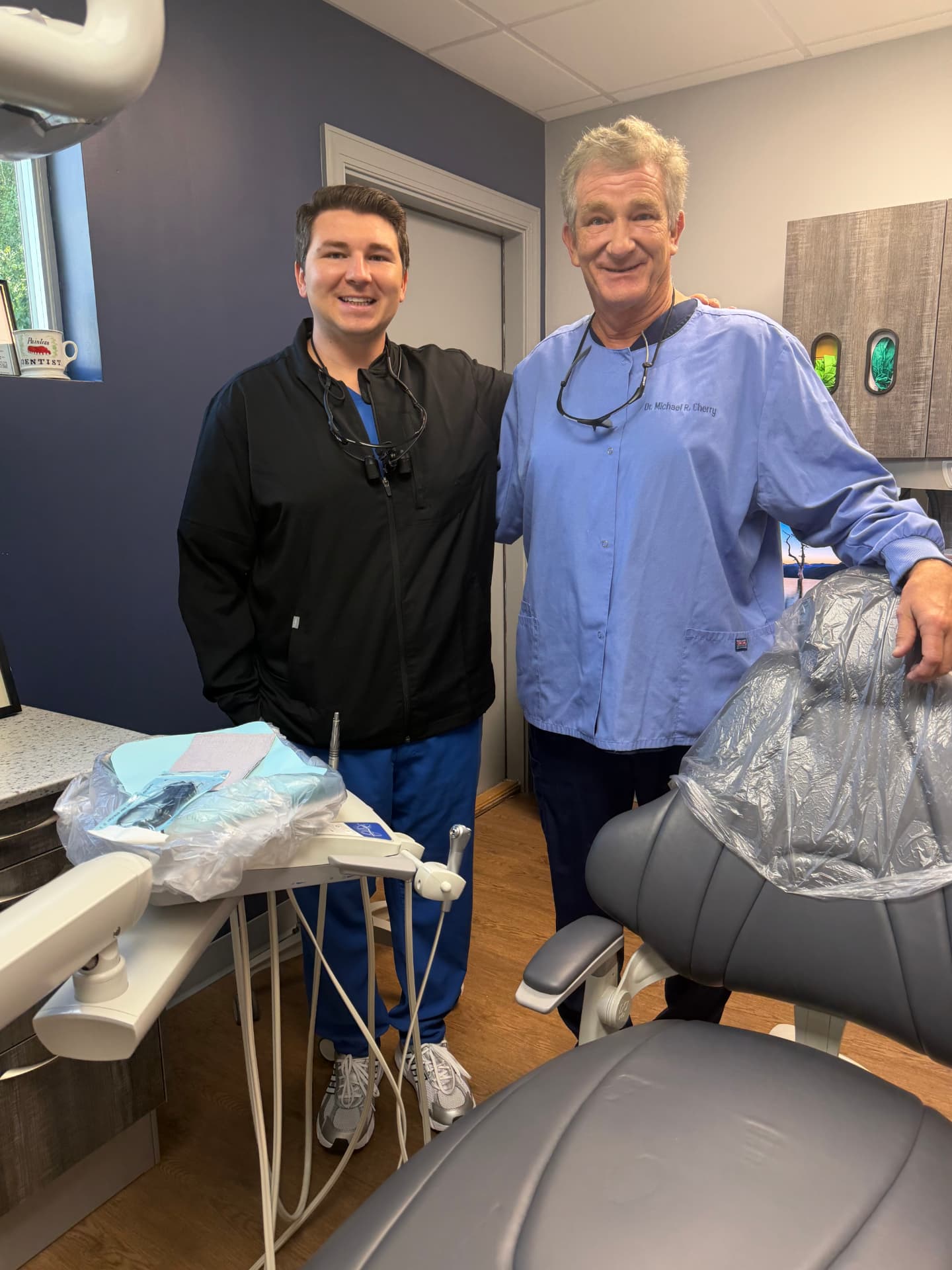 Dr. Michael R. Cherry and Dr. Carson S. Cherry in the treatment room